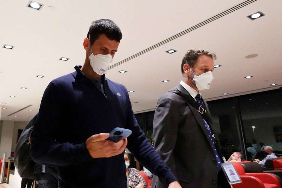 Novak Djokovic walks in Melbourne Airport before boarding a flight in 2022
