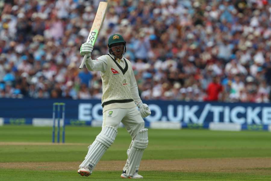 Australia's Usman Khawaja celebrates after reaching his century during play on day two of the first Ashes cricket Test match