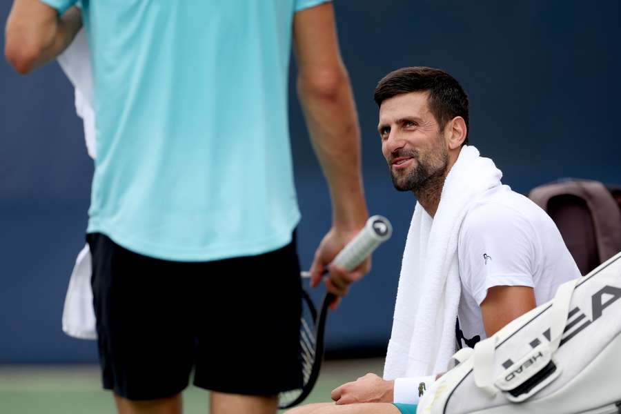 Novak Djokovic of Serbia cools down while training in preparation for the US Open