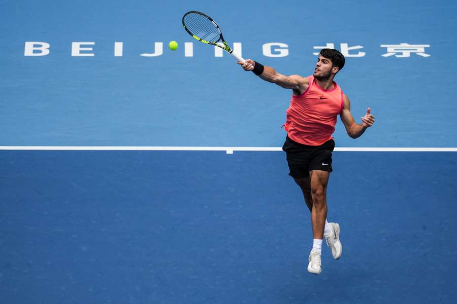 Carlos Alcaraz of Spain plays a forehand against Giovanni Mpetshi Perricard of France