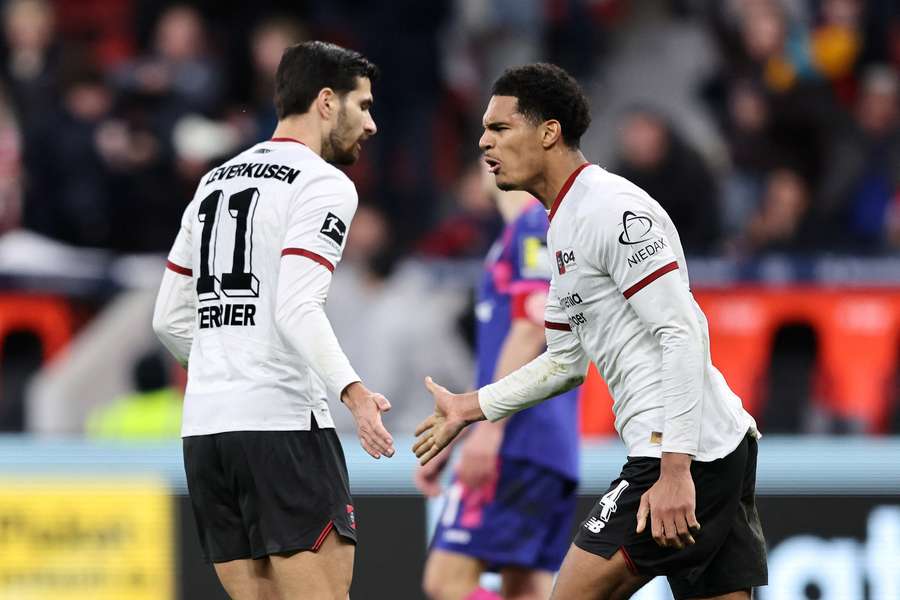 Quansah (right) celebrates his goal