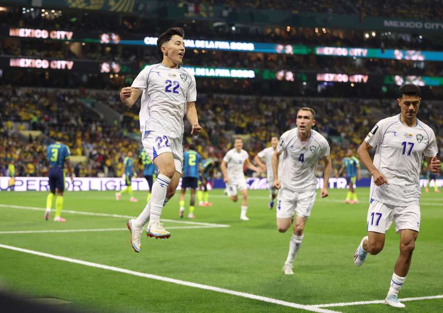 Abbosbek Fayzullaev (left) celebrates Uzbekistan's first goal at 2026 FIFA World Cup Abbosbek Fayzullaev (left) celebrates Uzbekistan's first goal at 2026 FIFA World Cup