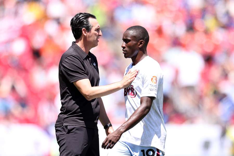Unai Emery, Manager of Aston Villa, embraces Moussa Diaby at half-time during the Premier League Summer Series match between Aston Villa and Brentford