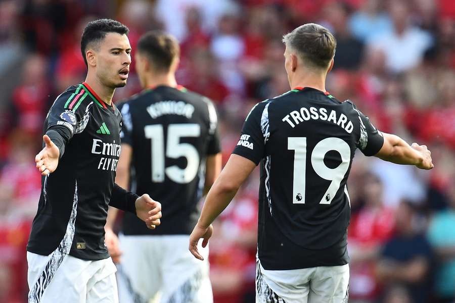 Arsenal's Gabriel Martinelli and Leandro Trossard celebrate after scoring the first goal against Liverpool