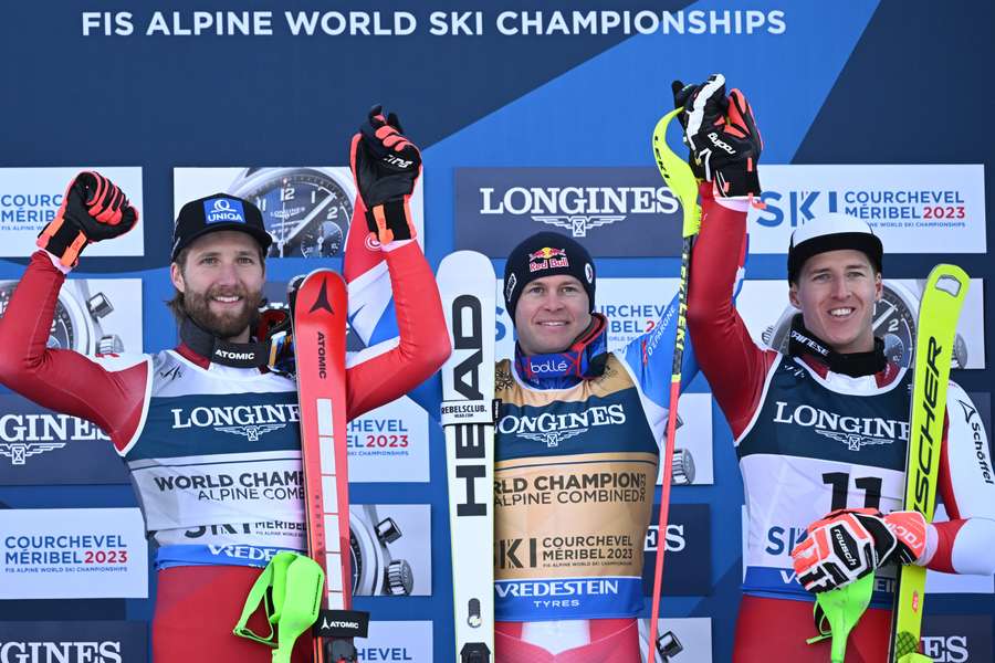 Alexis Pinturault, Marco Schwarz and Raphael Haaser celebrate on the podium