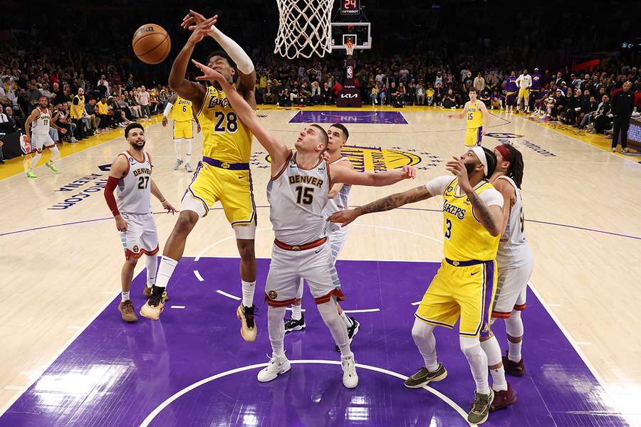 Nikola Jokic #15 of the Denver Nuggets blocks Rui Hachimura #28 of the Los Angeles Lakers