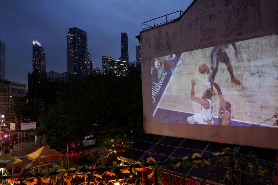 New York Knicks fans watch their team on the big screen during Game 4 of the NBA Finals.