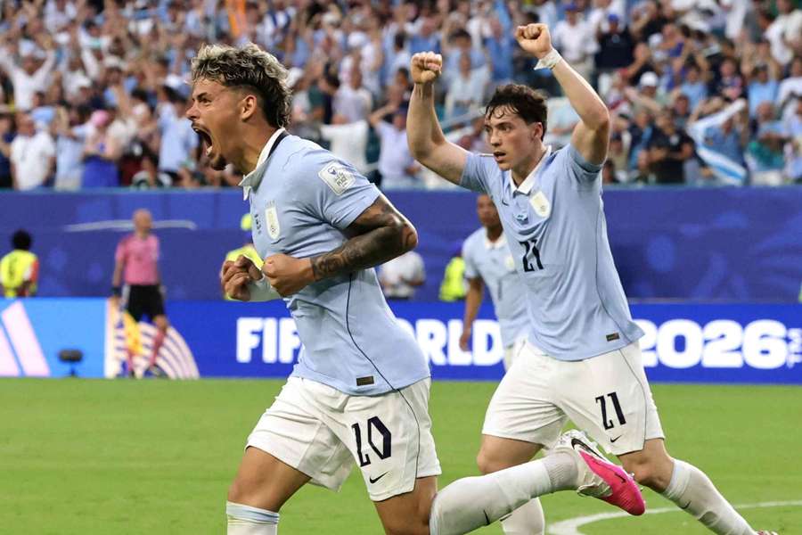 Uruguay's Maxi Araujo celebrates scoring their first goal with Federico Vinas Uruguay's Maxi Araujo celebrates scoring their first goal with Federico Vinas