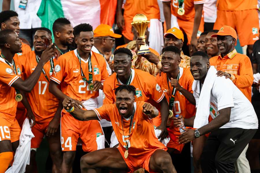 Ivorian players celebrate after winning at the end of the Africa Cup of Nations