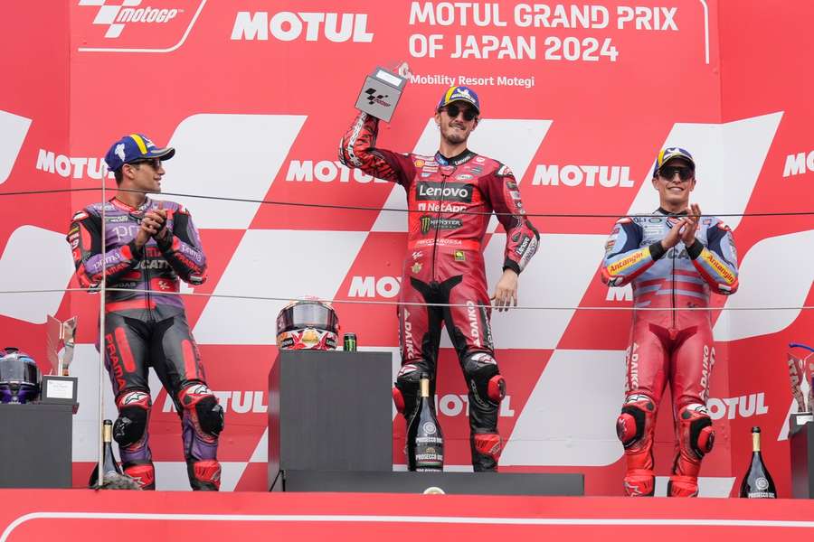 Francesco Bagnaia (C) on top of the podium