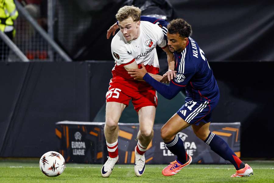 FC Utrecht's Derry John Murkin and Ruben Kluivert of Olympique Lyon fight for the ball