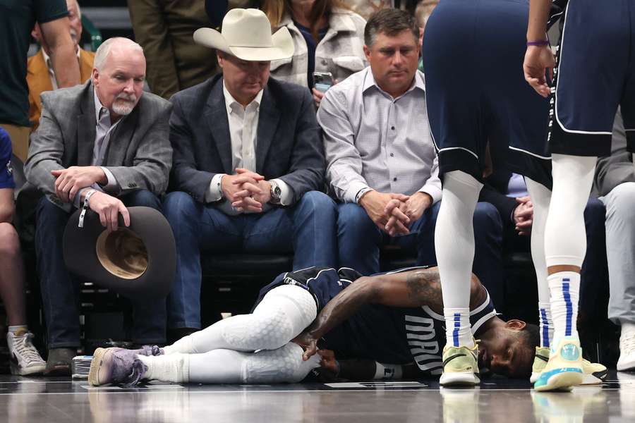 Kyrie Irving on the court after sustaining a knee injury during a matchup against the Sacramento Kings (March 3, 2025)