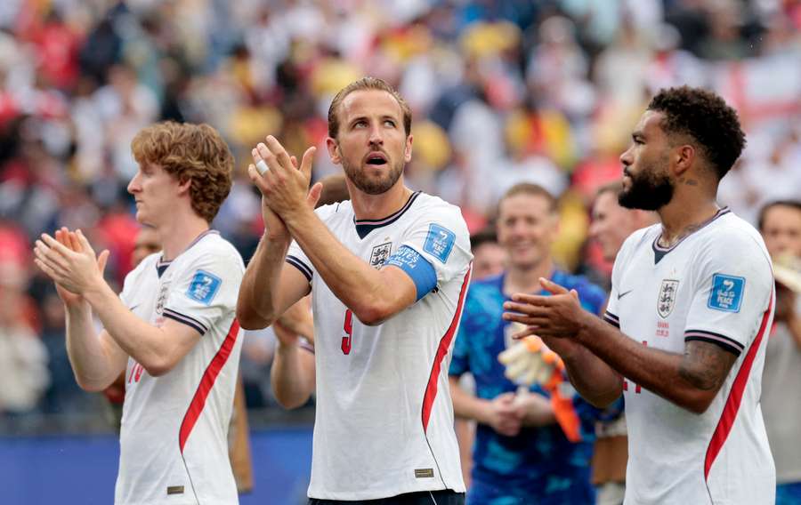 England's Harry Kane, Reece James and Anthony Gordon applaud fans after the match