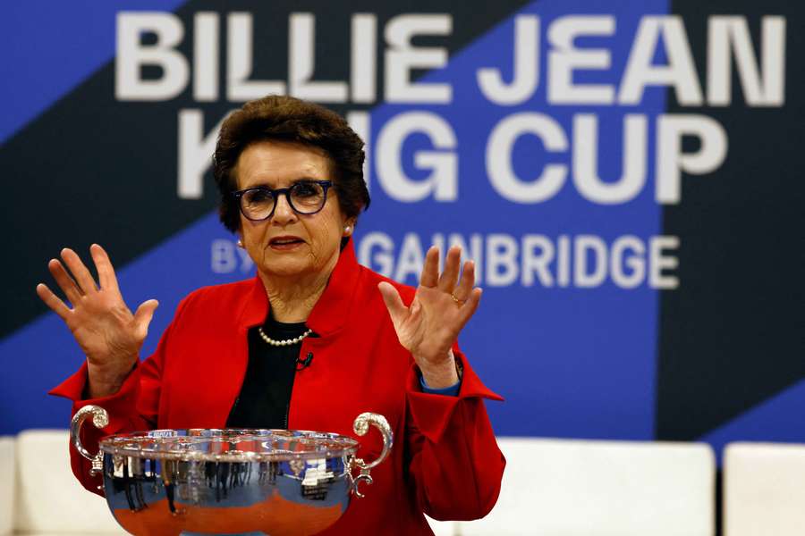 Former player Billie Jean King poses with the trophy