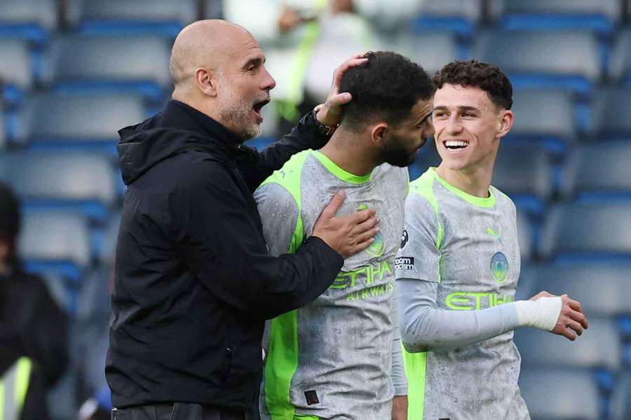 Manchester City manager Pep Guardiola celebrates with Rayan Ait-Nouri after the match