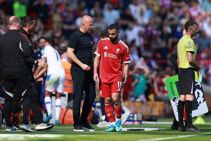 Liverpool's Mohamed Salah with manager Arne Slot after being substituted