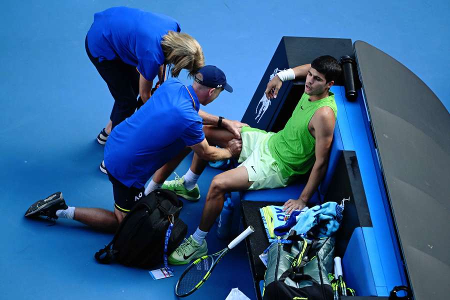 Carlos Alcaraz receives treatment