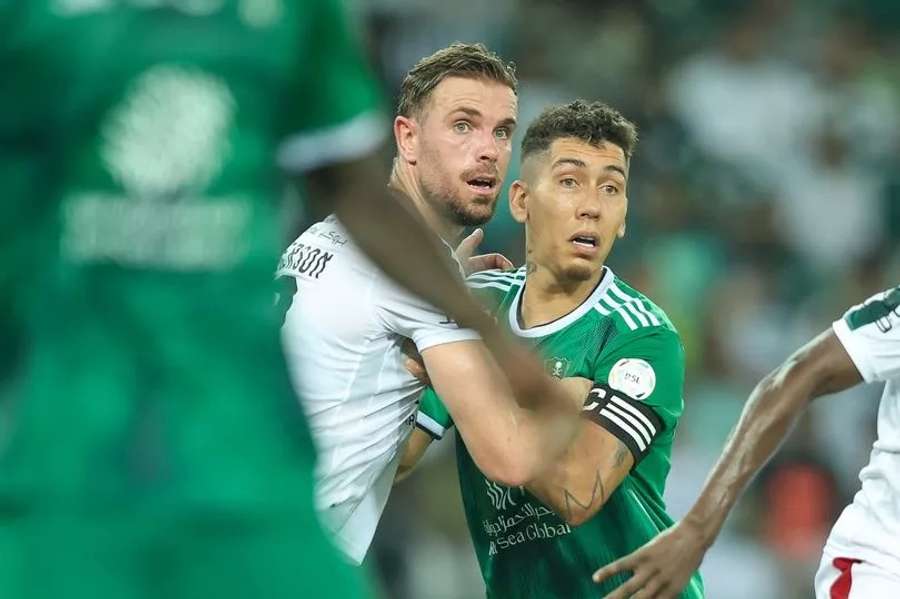 Jordan Henderson and former Liverpool teammate Roberto Firmino