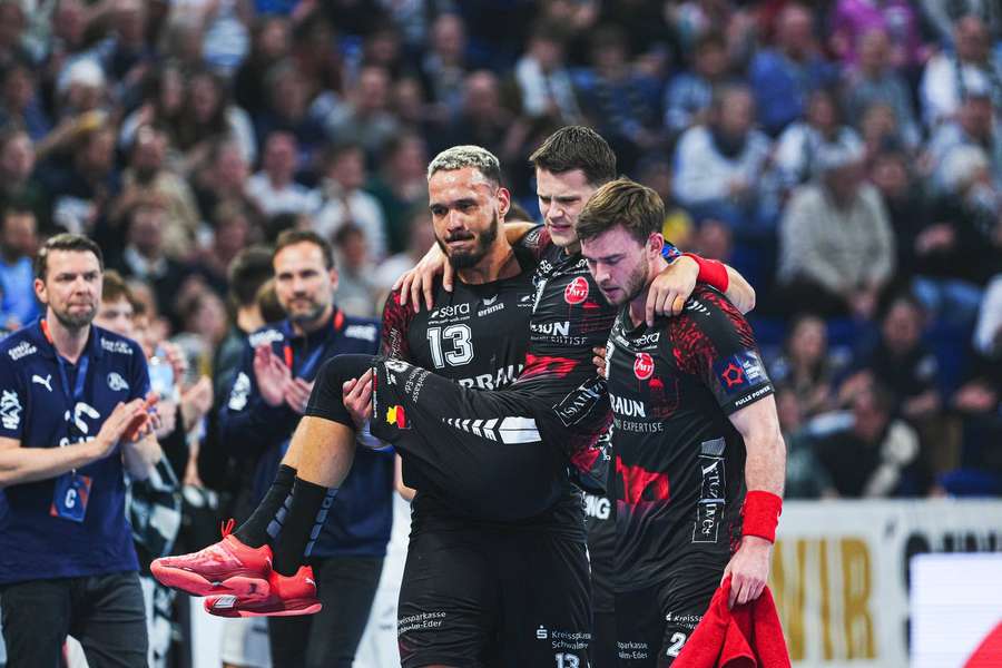 Mensing is carried off following his tumble in the beginning of the match.