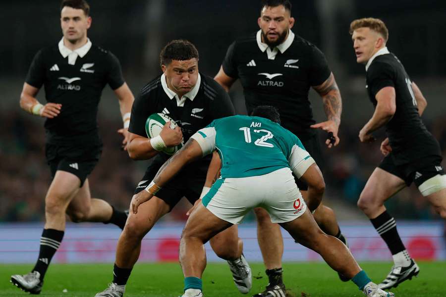 New Zealand's Tamaiti Williams in action with Ireland's Bundee Aki