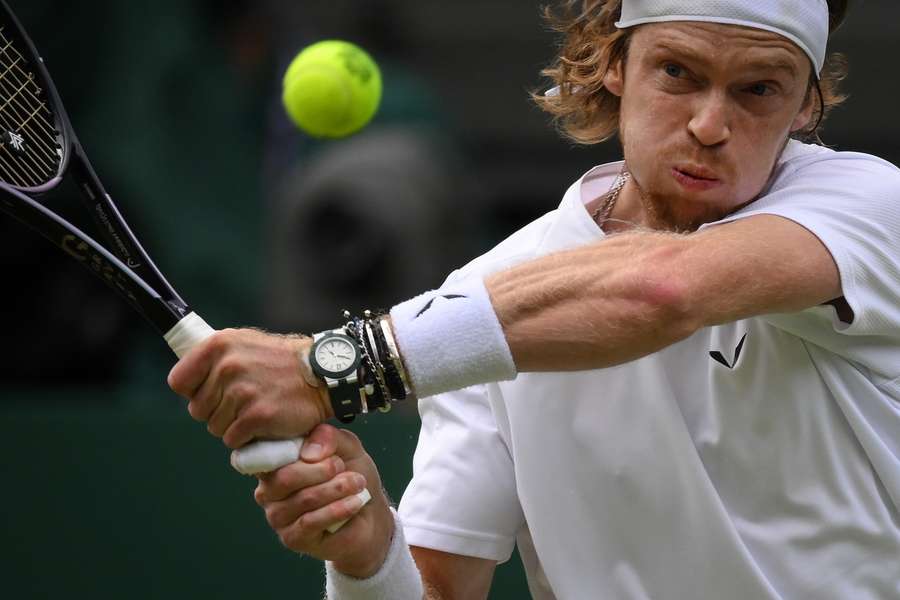 Russia's Andrey Rublev returns the ball to Serbia's Novak Djokovic