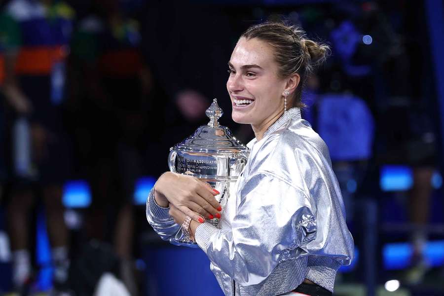 Aryna Sabalenka hugs her trophy after defeating Amanda Anisimova at the 2025 US Open
