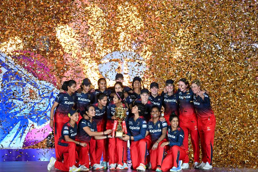 Royal Challengers Bangalore celebrate after winning the WPL final