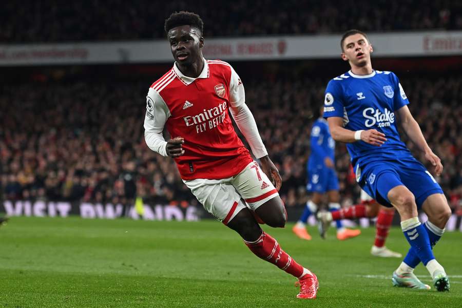Arsenal's English midfielder Bukayo Saka celebrates scoring the opening goal