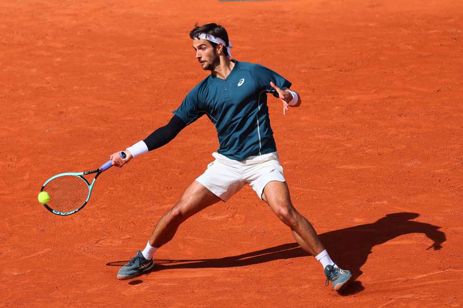 Italy's Lorenzo Musetti in action during his first-round match against Germany's Yannick Hanfmann