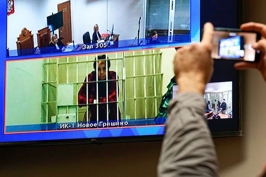 Jailed US basketball player Brittney Griner is seen on a screen via a video link during a court hearing near Moscow