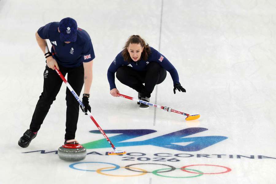 Bruce Mouat of Britain in action with Jennifer Dodds of Britain