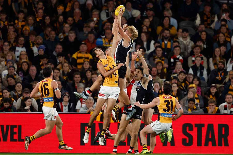 St Kilda's 'Flying Viking' Alixzander Tauru leaps above the pack to take a mark against Hawthorn at the weekend.