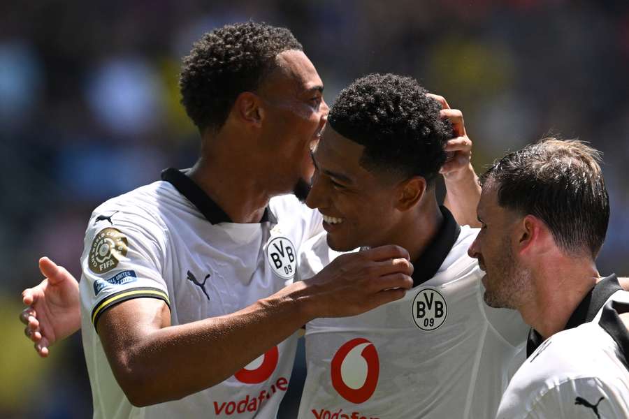 Jobe Bellingham is congratulated by his Dortmund teammates after scoring at the end of the first half