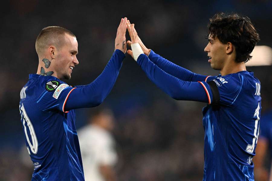 Mykhailo Mudryk of Chelsea celebrates with teammate Joao Felix after scoring his team's fifth goal