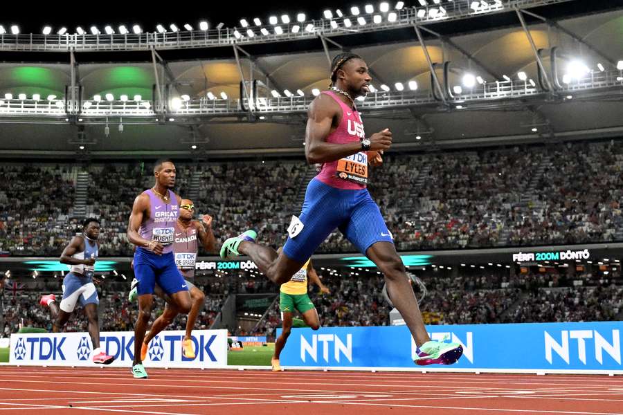 Noah Lyles crosses the finish line to win the men's 200m final