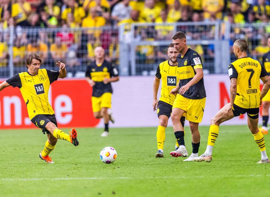 Ebi Smolarek (L) during Roman Weidenfeller's farewell match with Jakub Blaszczykowski and Lukas Piszczek