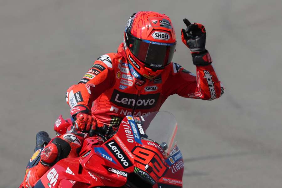Ducati Lenovo Team's Spanish rider Marc Marquez celebrates pole position after the free practice session of the MotoGP Aragon Grand Prix