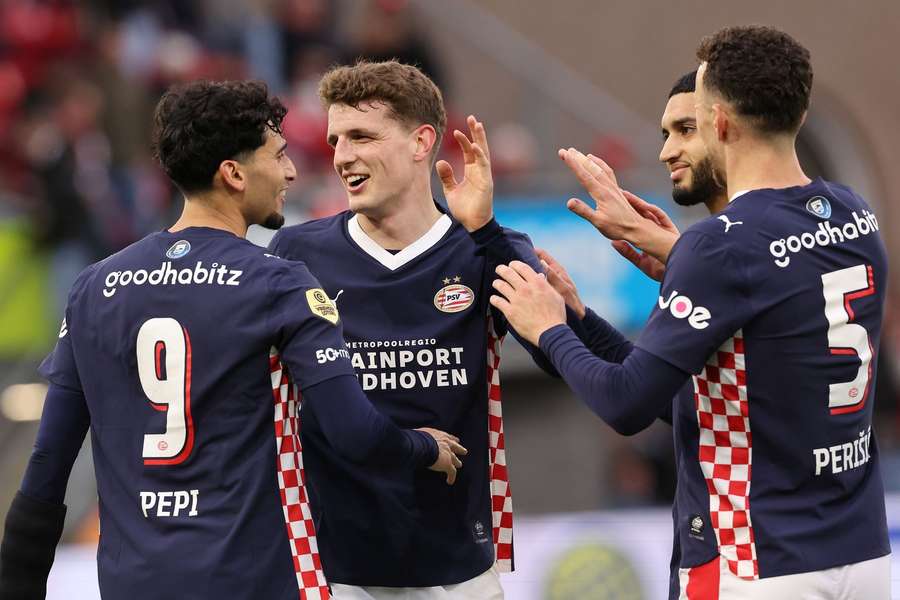 PSV's Ricardo Pepi (L) celebrates scoring the 1-0 with team-mates Ricardo Til, Ismael Saibari, and Ivan Perisic