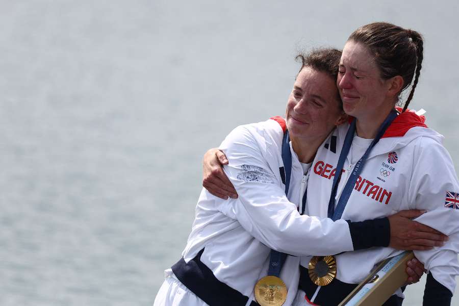 Gold medalists Emily Craig of Britain and Imogen Grant of Britain celebrate on the podium