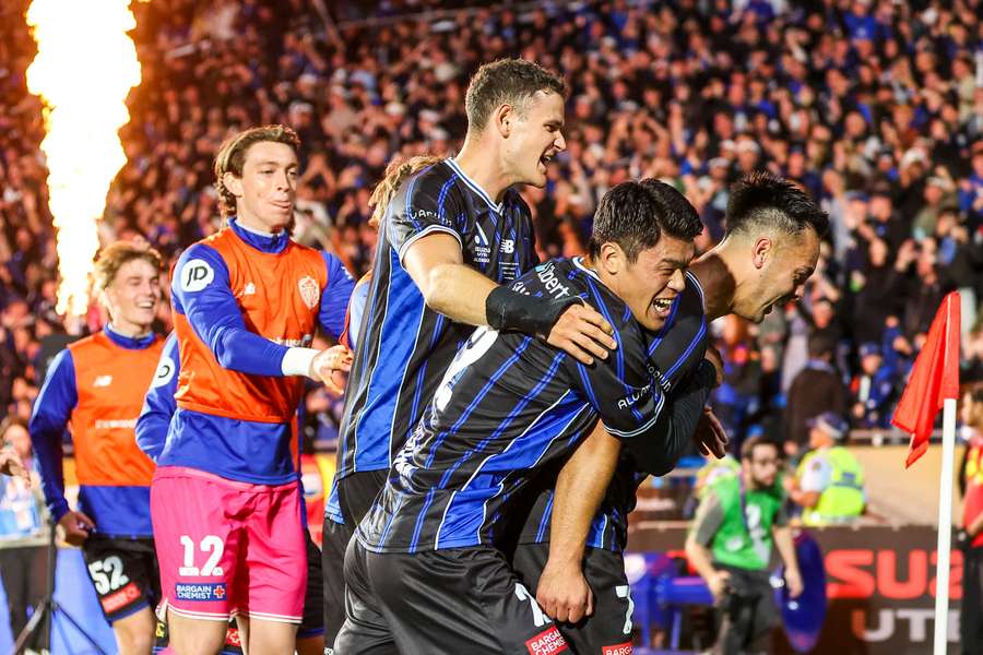 Cameron Howieson (right) celebrates his goal