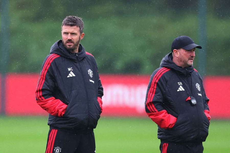 Manchester United manager Michael Carrick with assistant coach Steve Holland during training