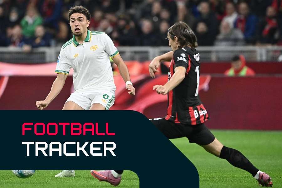 Neil El Aynaoui fights for the ball with AC Milan's Luka Modric