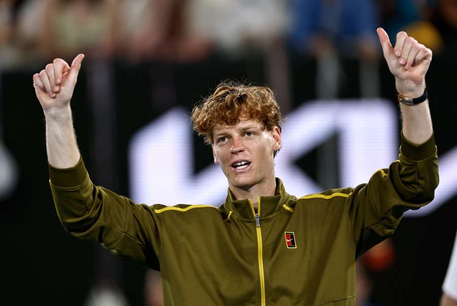 Jannik Sinner celebrates after advancing at the Australian Open
