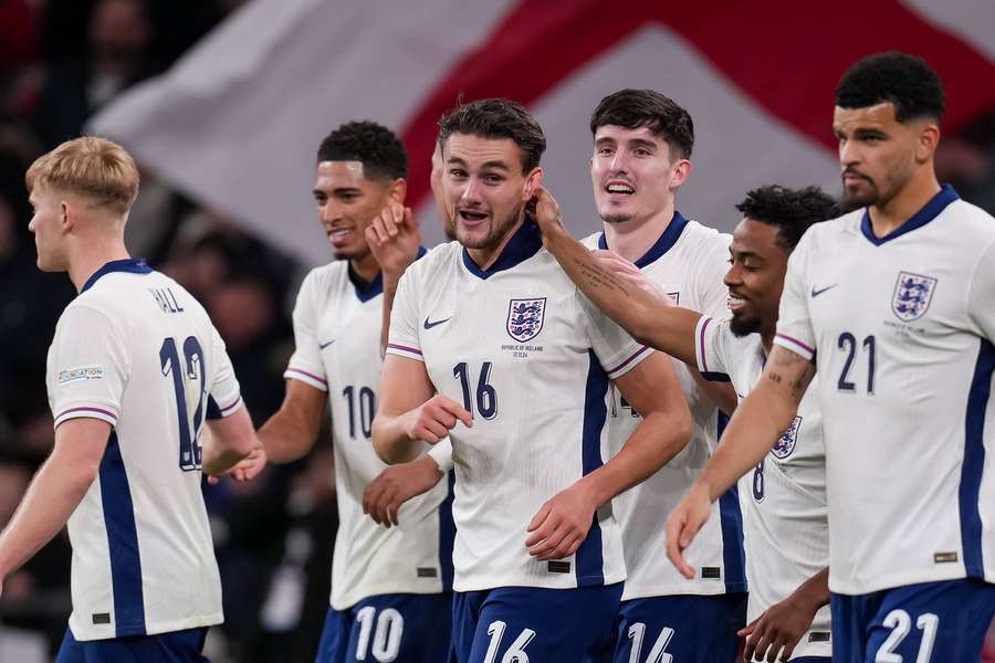 Taylor Harwood-Bellis 16 of England centre celebrates after he scores