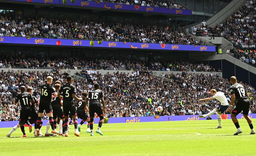 Tottenham Hotspur's English striker Harry Kane scores the opening goal during the English Premier League football match between Tottenham Hotspur and Brentford