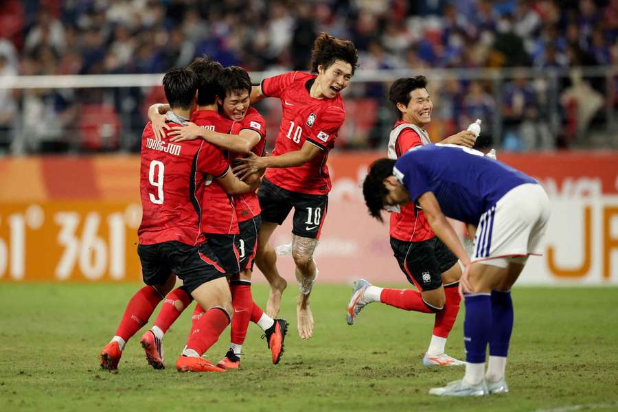South Korea celebrate their victory over Japan