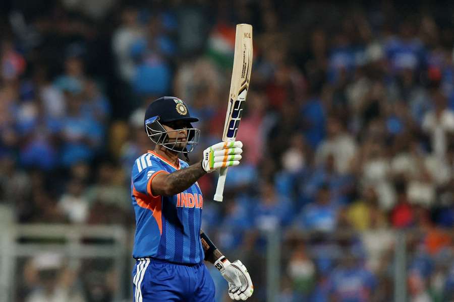 India's Suryakumar Yadav celebrates after reaching his half century