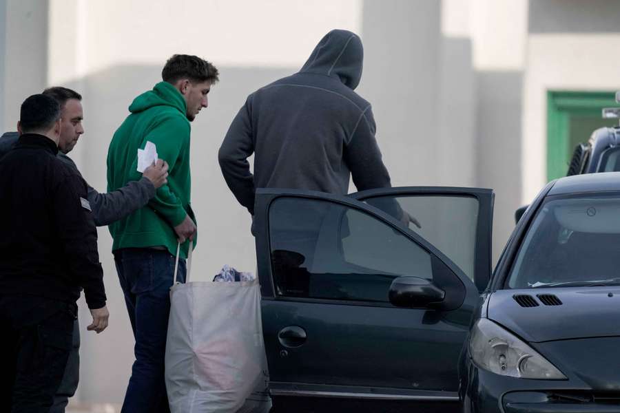 Oscar Jegou (2nd-R) and Hugo Auradou (R) are escorted by members of the Mendoza prison service