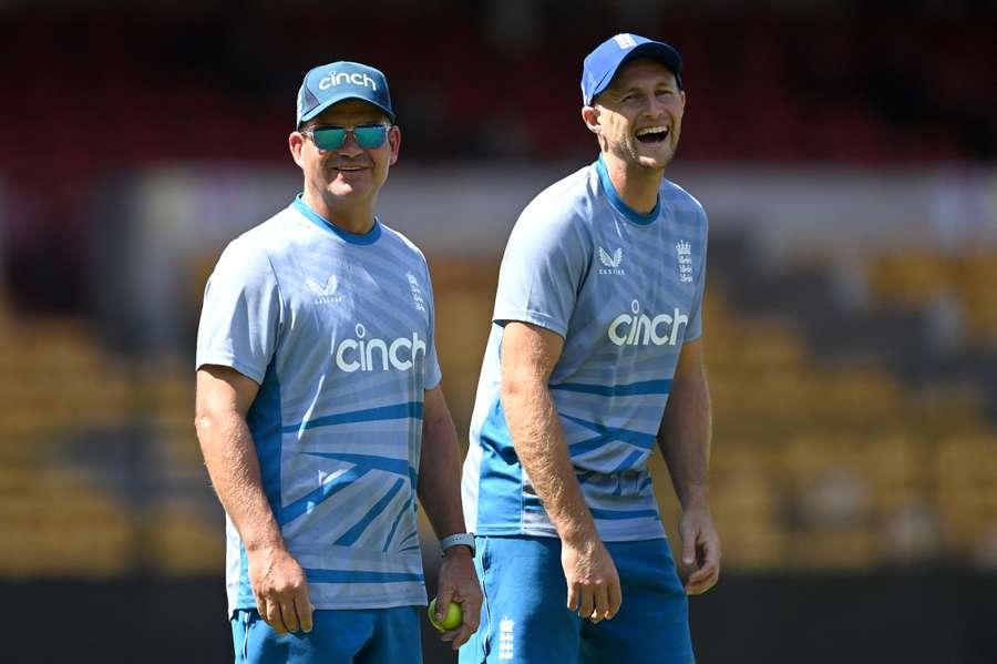 Mott (L) watches on as England train