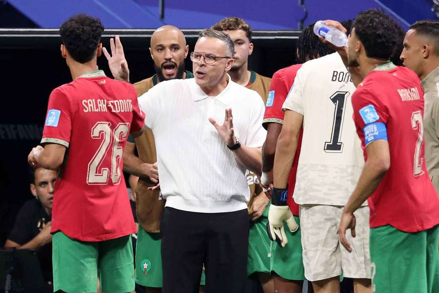 Morocco coach Mohamed Ouahbi speaks to his players